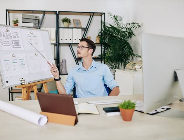 A web professional working in his office